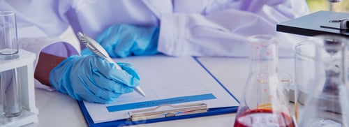 Preview: Banner Scientist woman holding chemical test yellow glass tube testing science laboratory. Banner As