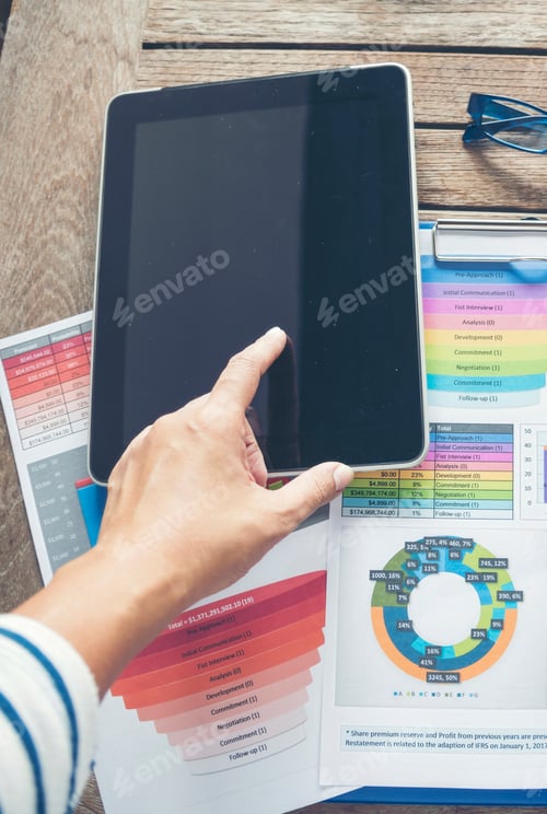 Preview: Vertical Businesswoman reading financial graph charts business info with computer laptop. Vertical h
