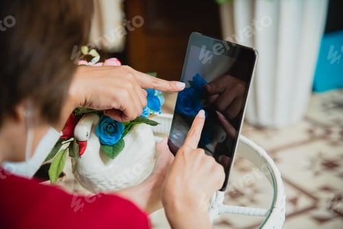 Preview: Chinese Businesswoman Working On Tablet Computer Outside Office. Beutiful Woman Wear Red Shirt Worki