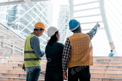 Preview: Civil Construction engineer teams shaking hands together wear work helmets worker on construction si