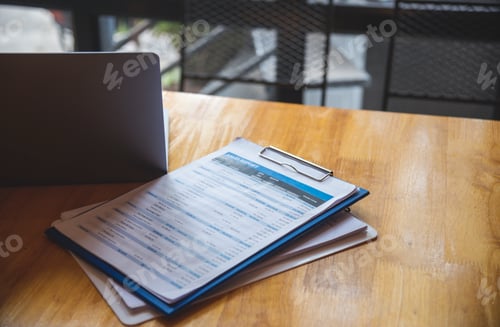Preview: Office laptop business financial document chart and graph on wooden table with coffee cup. Flat lay
