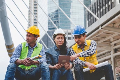 Preview: Civil Construction engineer teams shaking hands together wear work helmets worker on construction si