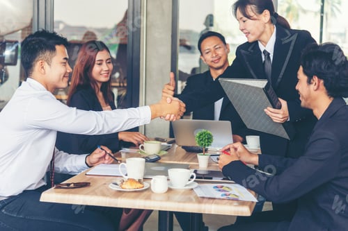 Preview: Team Business Partners shaking hands together to Greeting Start up small business in meeting room. S
