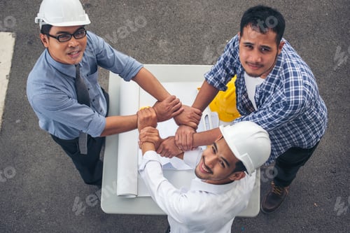 Preview: Group of multiracial people Teamwork meeting join hands Engineer Manager Foreman fist bump together.