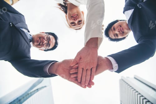 Preview: Multiethnic Teamwork friendship group brainstorming togetherness. Business people team holding hands