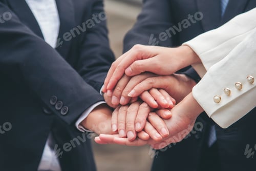 Preview: Multiethnic Teamwork friendship group brainstorming togetherness. Business people team holding hands