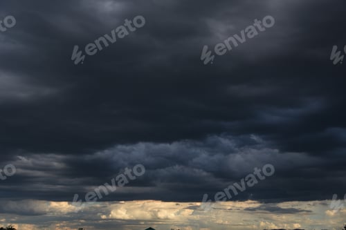 Preview: Dramatic dark storm rain clouds black sky background. Dark thunderstorm clouds rainny atmosphere. Me