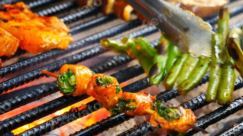Preview: BBQ Barbecue grilled meat stick on fire flame with hot charcoal cooking outside. Beef grilling picni
