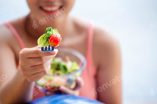 Preview: Healthy woman workout holding organic salad bowl healthy lifestyle. Wellness Asian women eating orga
