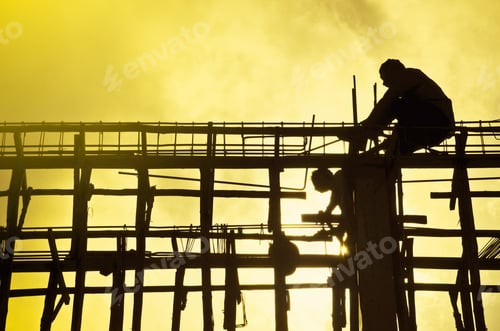 Preview: Silhouette construction site with worker on sunset. Construction concept.
