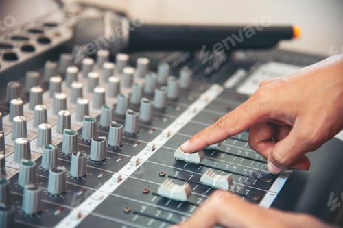 Preview: Production sound engineer woman hands adjusting volume equalizer voice, mixing console. DJ sound eng