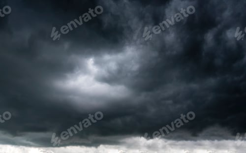 Preview: Dramatic dark storm rain clouds black sky background. Dark thunderstorm clouds rainny atmosphere. Me