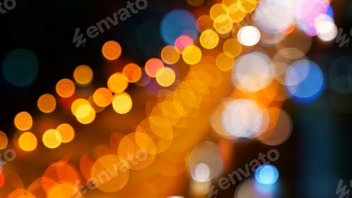 Preview: Blurred background night city bokeh car drive on road in nightlife. Light line traffic jam in black