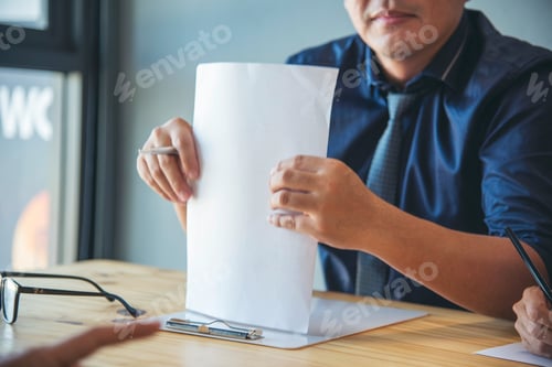 Preview: Businessman hands note meeting document in conference room. man Hands writing planning notebook. Clo