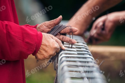 Preview: Construction Worker hands using pincer pliers iron wire. Outdoor Worker using wire bending pliers, c