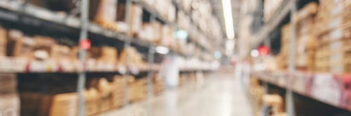 Preview: Blurred Background Commercial packaging on steel rack. Aisle in storehouse inventory. Warehouse back
