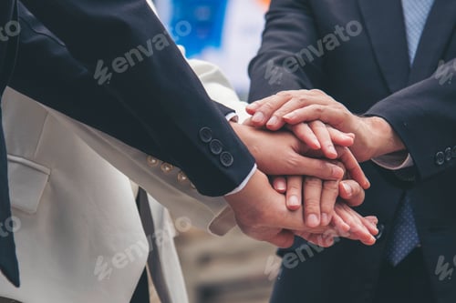 Preview: Multiethnic Teamwork friendship group brainstorming togetherness. Business people team holding hands