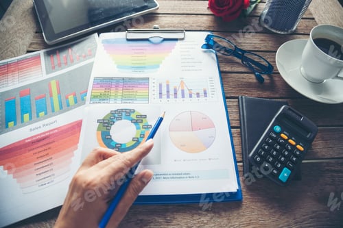 Preview: Office laptop business financial document chart and graph on wooden table with coffee cup. Flat lay
