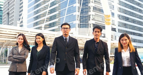 Preview: Portrait Group of businesspeople arms crossed smiling look at camera in modern city background. Happ