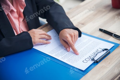 Preview: Close up businesswoman hands manager signing reading business contract document. Businesspeople hand