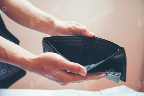 Preview: Unemployed man showing empty wallet. poor man.