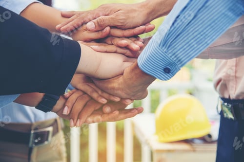 Preview: Close up hands of team work collaborator work in construction. team engineering meeting conference.