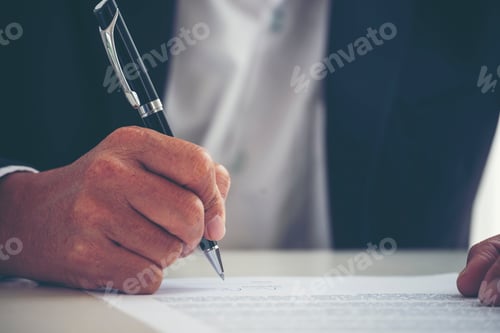 Preview: Businessman hand using pen signing on new contract to starting projects in conference room. Close up