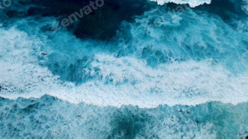 Preview: Turquoise ocean sea water white wave splashing deep blue sea. Bird eye view monster wave splash on r