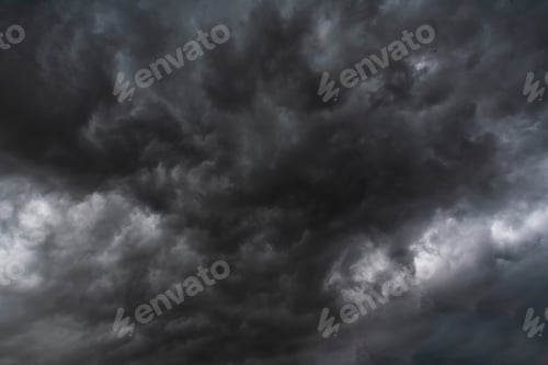 Preview: Dramatic dark storm rain clouds black sky background. Dark thunderstorm clouds rainny atmosphere. Me