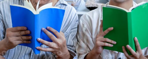 Preview: Banner two man holding book reading magazine together living room. Man relax read book happy learn.