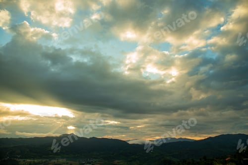 Preview: Dramatic sunset over mountain landscape. Beautiful landscape foggy hills twilight time. Blue golden