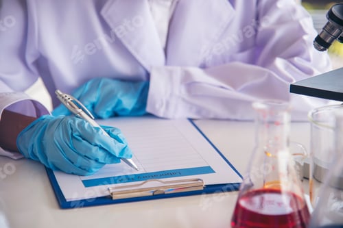 Preview: Closeup Woman scientist hand use dropper in lab look at science microscope medical test, research bi