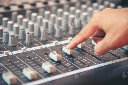 Preview: Production sound engineer hands working on recording studio mixing voice control. Expert adjusting v