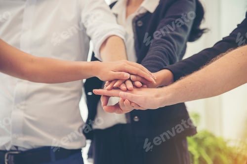 Preview: Group of diversity people with success partnership fist bump of hands together to show power and uni