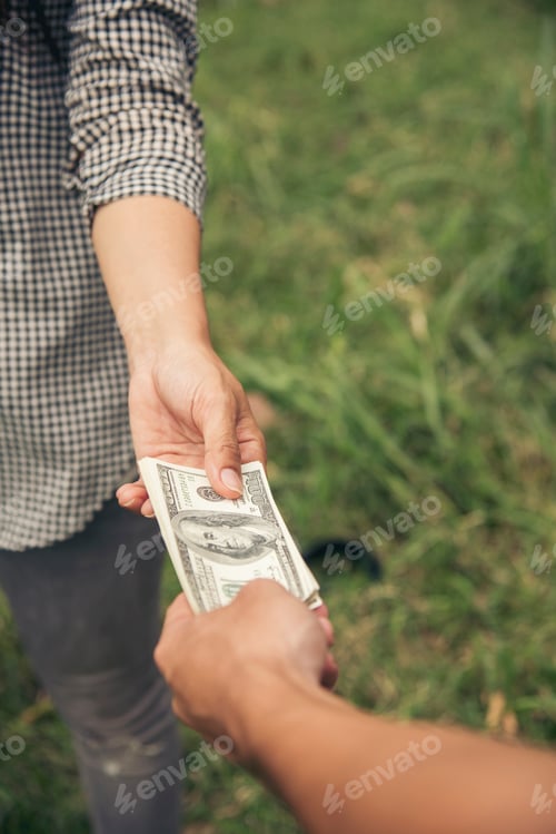 Preview: Close up hands giving money bribe payment. Hands holding dollar bill bribery financial economy busin