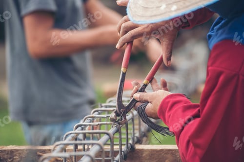 Preview: Construction Men hands bending cutting steel wire fences bar reinforcement of concrete work. Worker