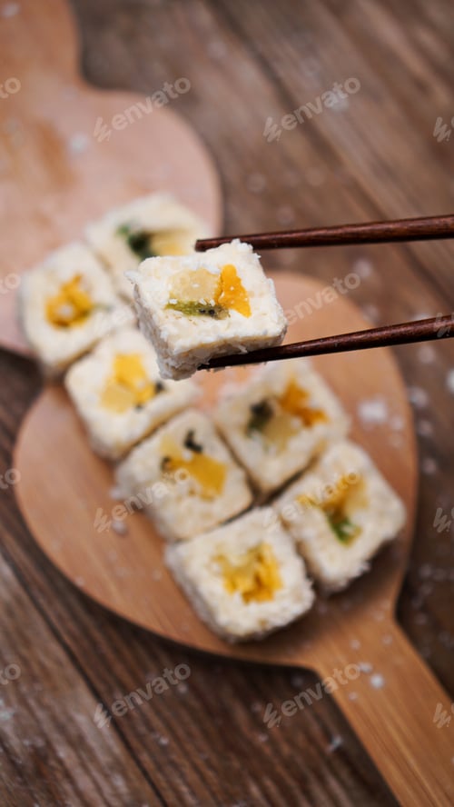 Preview: Sushi delivery. Sweet rolls made from rice, pineapple, kiwi and mango.