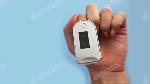 Preview: Medical device for hypoxia. Female finger in a pulse oximeter
