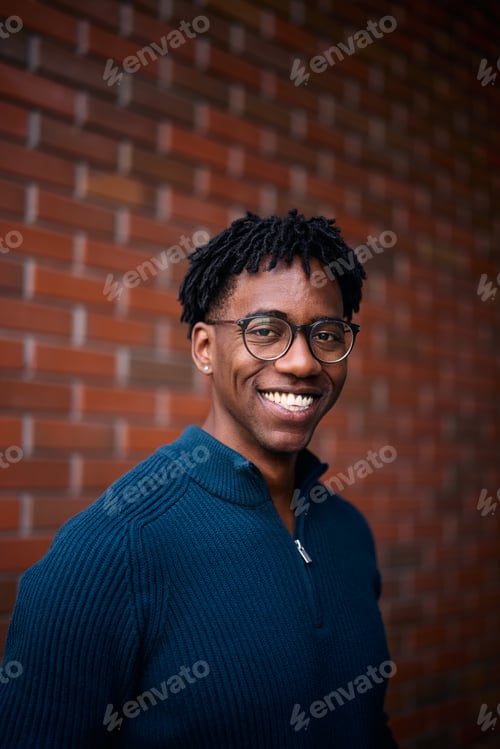 Preview: Portrait of young happy black man looking at camera.