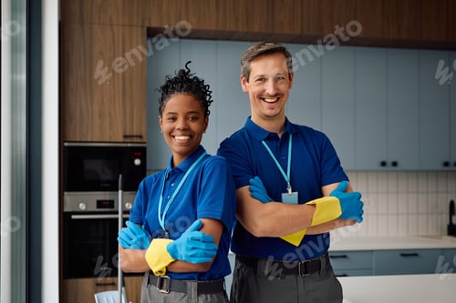 Preview: Portrait of confident professional cleaning staff members looking at camera.