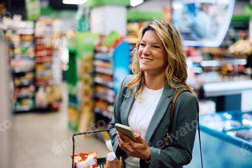 Preview: Happy woman shopping groceries at the store.