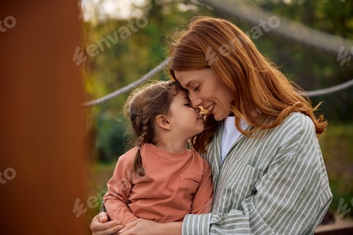 Preview: Loving mother and daughter enjoying in time together in nature.