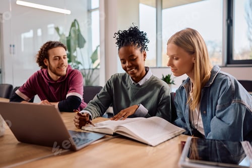 Preview: Diverse college friends studying together in the classroom.