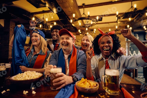 Preview: Excited supporters cheering for their favorite team while watching sports match in a pub.