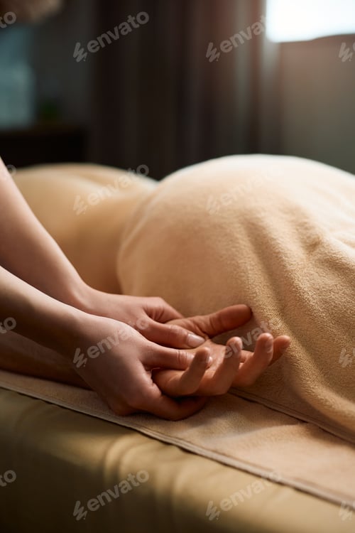 Preview: Close up of hand massage at health spa.