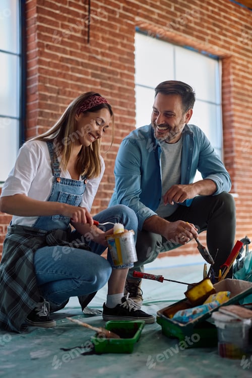 Preview: Happy couple enjoying in renovation process at their new home.