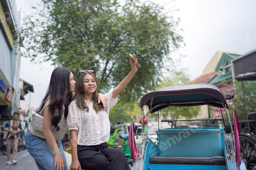 Preview: Young Female Friends Taking Selfie Together in Yogyakarta Indonesia