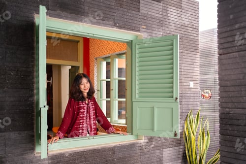 Preview: Young Indonesian Woman at Historic Window Architecture