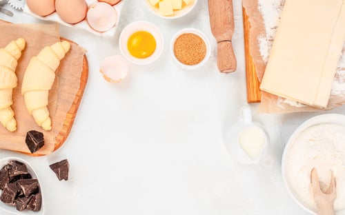Preview: Croissant ingredients and dough on white background, baking concept, top view