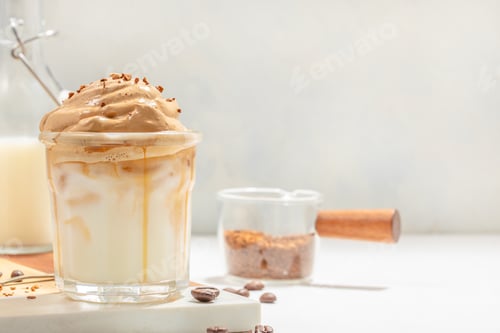 Preview: Dalgona iced coffee with whipped foam and milk on light background, trendy coffee drink concept